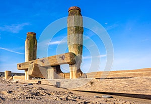 Wooden Sea groin in sand