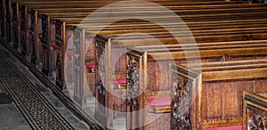 Wooden seats in Bath Abbey in Bath, Somerset, England