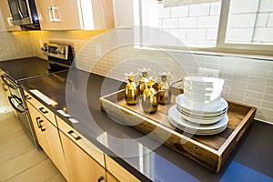 Wooden Serving Tray On Long Kitchen Counter