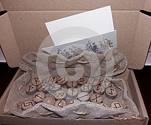 Wooden set of runes Elder Futhark in a bag