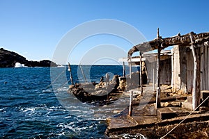 Wooden shacks on rocky coast