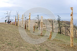 Wooden shaman totems, sacred poles at Burhan Cape, Baikal Lake, Russian Federation