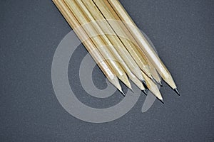 Wooden sharpened pencils on a black background