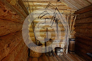 Wooden shed with old peasant's implements