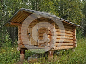 Wooden shed at taiga forest