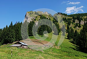 Wooden sheepfold in mountains