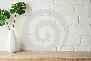 Wooden shelf background with home decor vase
