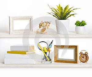 Wooden shelves with different office related objects