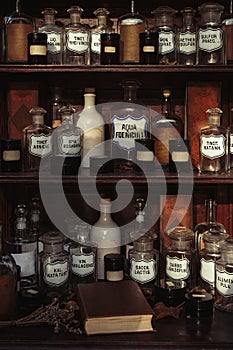 Wooden shelves with old bottles and labels