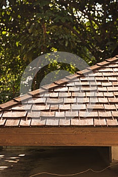 Wooden shingle Roof with sunlight casted.