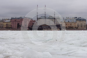 Wooden ship in the ice river in the winter