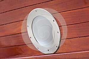 Wooden Ship porthole. View from outside