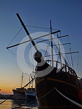 Wooden ship in sunset