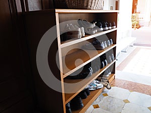 Wooden shoe cabinet with shoes