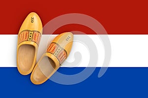 Wooden shoes flatlay on the colors of the dutch flag, as a concept for the dutch culture