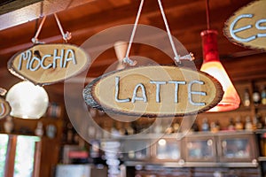 Wooden sign coffee menu with hanging on counter bar