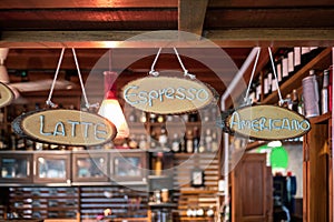 Wooden sign coffee menu with hanging on counter bar