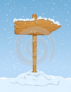 Wooden sign with falling snow