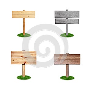 Wooden sign on grass isolated onwhite background photo
