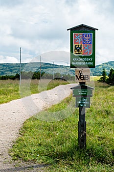 The wooden sign informs of Giant Mountains National Park