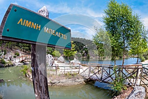 The wooden sign of Lake Beletsi on Parnes mountain in Athens, Greece