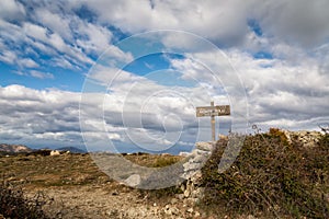 Wooden sign for Monte Tolu in Balagne region of Corsica photo