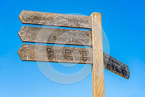 Wooden sign post with directions in Epping Forest