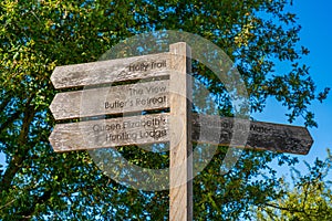 Wooden sign post with directions in Epping Forest