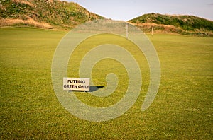 Wooden sign for a putting green