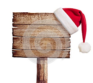 Wooden sign with red Santa's hat