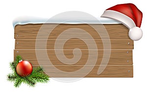 Wooden sign with Santa`s hat photo