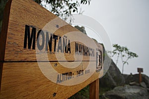 Wooden sign at the top of the famous Huayna Picchu mountain at the UNESCO World heritage site of Machu Picchu, Peru