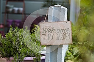 Wooden sign welcoming to the garden