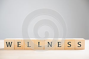 Wooden sign with the word wellness