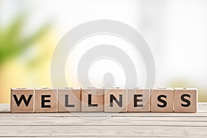 Wooden sign with the word wellness