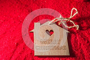 wooden sign written "Merry Christmas" with copy space and red background, Christmas concept