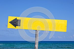 Wooden signboard on the beach