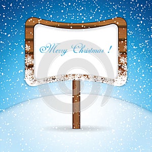 Wooden signboard in snow