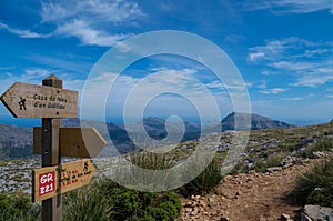 Wooden signpost for hikers in Mallorca along the GR 221