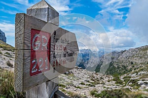 Wooden signpost for hikers in Mallorca along the GR 221