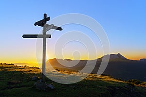 Wooden signpost in Saibi with view of Anboto mountain photo