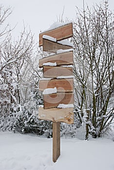 Wooden Signpost With Snow In Winter