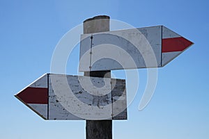 Wooden signpost with two arrows