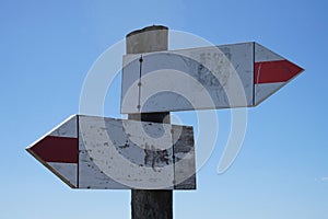 Wooden signpost with two arrows