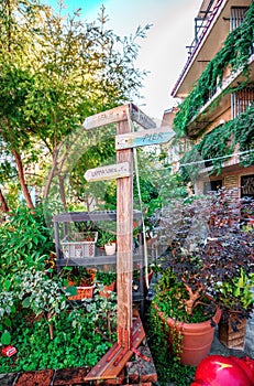 Wooden signs on Family Walk trail in Yung Shue Wan village on Lamma Island in Hong Kong