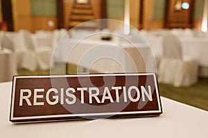 Wooden signs of registration on a table.