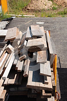 Wooden slats in various lengths and widths for scaffolding on construction site