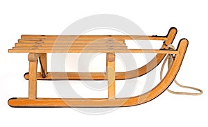 Wooden sledge isolated over white