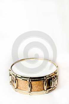 Wooden snare drum with gold rims