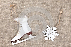 Wooden snowflakes and toy skates.